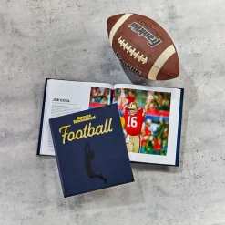 The Story of Football in 100 Photographs Book by Sports Illustrated - Navy